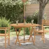 An outdoor patio scene with a wooden table and chairs, set up for drinks. Náhled obrázku produktu