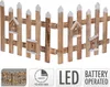 A wooden fence with birdhouses and LED lights. Náhled obrázku produktu
