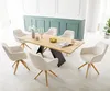 A dining room set with a wooden table and six chairs. Produktbild-Vorschau