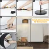 A collage of images showing the assembly steps of a floor lamp, followed by a lifestyle shot of the assembled lamp in a room. Produktbild-Vorschau
