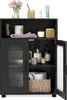 A black bathroom cabinet with two doors, one of which is open, displaying various bathroom items inside. Anteprima dell’immagine prodotto