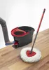 A person is using a Vileda Easy Wring & Clean mop and bucket system on a wooden floor. Produktbild-Vorschau
