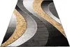 A modern rug with abstract wavy patterns in gray, black, and yellow. Anteprima dell’immagine prodotto