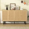 A wooden sideboard with rattan doors is displayed in a room with decorative items on top. Náhľad obrázku produktu