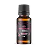 A product shot of a small amber glass bottle with a black cap and a black label featuring pink circular graphics and text. Produktbild-Vorschau