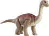 A toy dinosaur standing on a white background. Voir les images du produit