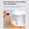 A close-up shot of someone adding essential oil to an aromatherapy diffuser. Náhled obrázku produktu