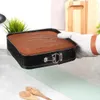 A cake is being removed from a springform pan by a hand wearing an oven mitt. Podgląd zdjęcia produktu