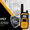 A walkie-talkie is shown in the foreground, with construction workers in hard hats in the background. The image highlights the product's waterproof and dust-proof features. Produktbild-Vorschau