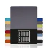 A stack of folded fabric sheets in various colors, with a large gray sheet prominently displayed in the center, and a black band at the bottom with a white logo. Produktbild-Vorschau