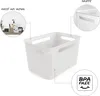 A white storage basket with cutouts is shown, with close-up views of its features and a graphic indicating it is BPA-free. Voir les images du produit