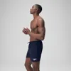 A man wearing navy blue Speedo swim shorts, shown from the side against a light gray background. Produktbild-Vorschau