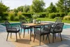An outdoor dining set with a table and six chairs next to a swimming pool. Anteprima dell’immagine prodotto