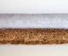 A close-up view of the layered materials of a mattress. Produktbild-Vorschau