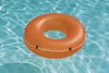 An orange swimming ring floating in clear blue water. Náhľad obrázku produktu