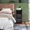 A bedroom scene with a bed and a nightstand. Náhled obrázku produktu