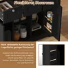 A close-up view of a black kitchen cabinet with various storage compartments and shelves, showcasing its organization features. Text overlays describe its storage capabilities. Voir les images du produit