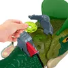 A hand is inserting a green disc into a toy dinosaur. Náhled obrázku produktu