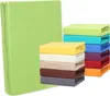 A stack of folded bedding in various colors next to a large, wrapped item of the same bedding. Produktbild-Vorschau