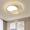 A modern ceiling light fixture with a circular design, mounted on a white ceiling. Náhled obrázku produktu