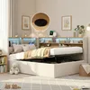 A bedroom scene with a bed that has storage space underneath and a headboard with shelves and lights. Náhled obrázku produktu