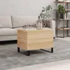 A living room scene with a couch, coffee table, and bookshelf. Produktbild-Vorschau