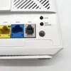 Close-up view of the back panel of a white router, showing various ports and indicator lights. Podgląd zdjęcia produktu