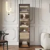A modern living room with a tall display cabinet filled with decorative items. Voir les images du produit