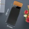 A black leather smartphone case with a phone partially inserted, shown with a bouquet of flowers and a gift box in the background. Náhled obrázku produktu
