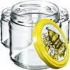 Several empty glass jars are arranged with one lid prominently displayed in the foreground. Podgląd zdjęcia produktu