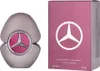 A perfume bottle and its packaging are displayed side-by-side against a white background. Voir les images du produit