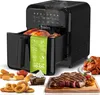 A black air fryer with a turkey inside, surrounded by various cooked foods like steak, chicken wings, onion rings, and nuggets. Produktbild-Vorschau