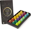 A box of assorted herbal tea bags, with the box partially open to reveal the pyramid-shaped tea bags arranged inside. Produktbild-Vorschau