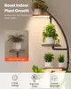 A plant stand with integrated grow lights, showcasing different plants on its shelves. Voir les images du produit