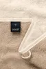 A close-up view of a JOOP! branded towel, showing the label and a hanging loop. Anteprima dell’immagine prodotto