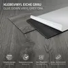 A close-up view of grey oak vinyl flooring planks, with one plank partially peeled back to show the adhesive backing. Icons and text highlight product features. Podgląd zdjęcia produktu