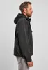 A man wearing a black hooded jacket and grey pants, shown from the side. Anteprima dell’immagine prodotto