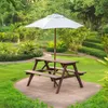 A wooden picnic table with an umbrella in a garden setting. Produktbild-Vorschau
