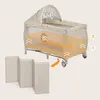 A baby crib with an overlay highlighting adjustable levels and a separate foldable mattress. Produktbild-Vorschau
