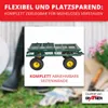 A green garden cart with yellow wheels is shown in a blurred outdoor setting with gardening tools and boots. Produktbild-Vorschau