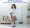 A woman is vacuuming a living room floor with a cordless vacuum cleaner. Produktbild-Vorschau