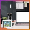 A desk setup with a laptop, weather station, and office supplies. Anteprima dell’immagine prodotto