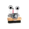 A close-up studio shot of a toy robot made from a brush and other recycled materials. Produktbild-Vorschau