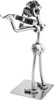 A metal figurine of a person playing a violin, made from nuts and bolts. Voir les images du produit