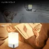 A split image showing a bedside lamp in use at night and a reading lamp illuminating a book. Podgląd zdjęcia produktu