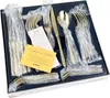 A set of gold-colored cutlery in a dark blue box, with some documentation. Produktbild-Vorschau