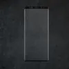 A smartphone screen protector is shown on a dark, textured surface. Produktbild-Vorschau