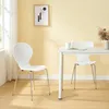 A dining set with two white chairs and a white table against a yellow wall. Podgląd zdjęcia produktu
