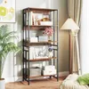 A tall, five-shelf bookshelf with various decorative items and books is shown in a room setting. Podgląd zdjęcia produktu