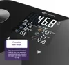 Close-up of a digital scale display showing various body statistics, with a marketing text overlay. Produktbild-Vorschau